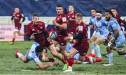 14 January 2022; Chris Farrell of Munster offloads to teammate Craig Casey as he is tackled by Louis Le Brun of Castres Olympique during the Heineken Champions Cup Pool B match between Castres Olympique and Munster at Stade Pierre Fabre in Castres, France. Photo by Manuel Blondeu/Sportsfile