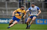 15 January 2022; Jack Browne of Clare in action against DJ Foran of Waterford during the 2022 Co-op Superstores Munster Hurling Cup Semi-Final match between Clare and Waterford at Cusack Park in Ennis, Clare. Photo by Sam Barnes/Sportsfile