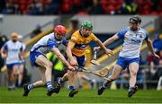 15 January 2022; Gary Cooney of Clare in action against Conor Dalton, left, and Conor Gleeson of Waterford during the 2022 Co-op Superstores Munster Hurling Cup Semi-Final match between Clare and Waterford at Cusack Park in Ennis, Clare. Photo by Sam Barnes/Sportsfile