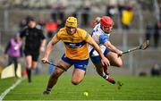 15 January 2022; Mark Rodgers of Clare in action against Darragh Lynch of Waterford during the 2022 Co-op Superstores Munster Hurling Cup Semi-Final match between Clare and Waterford at Cusack Park in Ennis, Clare. Photo by Sam Barnes/Sportsfile