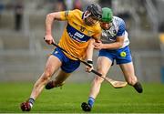 15 January 2022; Cathal Malone of Clare in action against Tom Barron of Waterford during the 2022 Co-op Superstores Munster Hurling Cup Semi-Final match between Clare and Waterford at Cusack Park in Ennis, Clare. Photo by Sam Barnes/Sportsfile