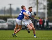 15 January 2022; Alan Farrell of Laois in action against Darragh Fitzgerald of Wicklow during the O'Byrne Cup Group B match between Laois and Wicklow at Crettyard GAA Club in Laois. Photo by Daire Brennan/Sportsfile