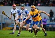 15 January 2022; Ian Beecher of Waterford in action against Jason McCarthy of Clare during the 2022 Co-op Superstores Munster Hurling Cup Semi-Final match between Clare and Waterford at Cusack Park in Ennis, Clare. Photo by Sam Barnes/Sportsfile