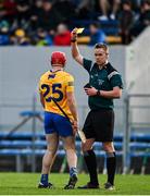 15 January 2022; Referee Michael Kennedy shows a yellow card to Mike Gough of Clare during the 2022 Co-op Superstores Munster Hurling Cup Semi-Final match between Clare and Waterford at Cusack Park in Ennis, Clare. Photo by Sam Barnes/Sportsfile