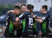 15 January 2022; Tiernan O’Halloran of Connacht, left, celebrates after scoring his side's first try with team-mates during the Heineken Champions Cup Pool B match between Connacht and Leicester Tigers at The Sportsground in Galway. Photo by Harry Murphy/Sportsfile