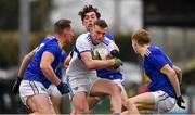 15 January 2022; Cathal Fennessy of Laois in action against Wicklow players, from left, Niall Donnelly, Pádraig O’Toole, and Andy Maher during the O'Byrne Cup Group B match between Laois and Wicklow at Crettyard GAA Club in Laois. Photo by Daire Brennan/Sportsfile