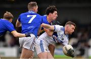 15 January 2022; Cathal Fennessy of Laois in action against Wicklow players, left to right, Andy Maher, Niall Donnelly, and Pádraig O’Toole, during the O'Byrne Cup Group B match between Laois and Wicklow at Crettyard GAA Club in Laois. Photo by Daire Brennan/Sportsfile
