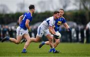15 January 2022; Eoin Lowry of Laois in action against Malachy Stone, left, and Dean Healy of Wicklow during the O'Byrne Cup Group B match between Laois and Wicklow at Crettyard GAA Club in Laois. Photo by Daire Brennan/Sportsfile