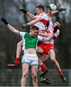 15 January 2022; Derry players Emmett Bradley, left, and Ciarán McFaul contest possession against Fermanagh players Brandon Horan, left, and Joe McDade during the Dr McKenna Cup round 3 match between Fermanagh and Derry at Shamrock Park in Roslea, Fermanagh. Photo by Piaras Ó Mídheach/Sportsfile