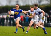 15 January 2022; Dean Healy of Wicklow in action against Alan Farrell, left, and Cian Doyle of Laois during the O'Byrne Cup Group B match between Laois and Wicklow at Crettyard GAA Club in Laois. Photo by Daire Brennan/Sportsfile