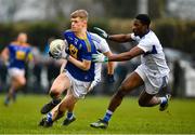 15 January 2022; Kevin Quinn of Wicklow in action against Collines Ugochukwu of Laois during the O'Byrne Cup Group B match between Laois and Wicklow at Crettyard GAA Club in Laois. Photo by Daire Brennan/Sportsfile