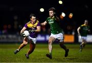 15 January 2022; Dylan Furlong of Wexford in action against Sarán Ó Fionnagáin of Meath during the O'Byrne Cup Group B match between Meath and Wexford at Ashbourne GAA Club in Ashbourne, Meath. Photo by Ben McShane/Sportsfile