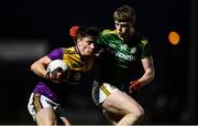 15 January 2022; Paidi Hughes of Wexford in action against Mathew Costello of Meath during the O'Byrne Cup Group B match between Meath and Wexford at Ashbourne GAA Club in Ashbourne, Meath. Photo by Ben McShane/Sportsfile