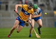 15 January 2022; Cathal Malone of Clare in action against Tom Barron of Waterford during the 2022 Co-op Superstores Munster Hurling Cup Semi-Final match between Clare and Waterford at Cusack Park in Ennis, Clare. Photo by Sam Barnes/Sportsfile