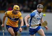 15 January 2022; Conor Gleeson of Waterford in action against Mark Rodgers of Clare during the 2022 Co-op Superstores Munster Hurling Cup Semi-Final match between Clare and Waterford at Cusack Park in Ennis, Clare. Photo by Sam Barnes/Sportsfile