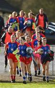 16 January 2022; St Peter's Dunboyne captain Fiona O'Neill, centre, leads her side out before the 2021 currentaccount.ie All-Ireland Ladies Senior Club Football Championship semi-final match between Mourneabbey and St Peter's Dunboyne at Clyda Rovers GAA, in Cork. Photo by Seb Daly/Sportsfile