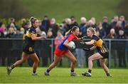 16 January 2022; Saoirse Quinn of St Peter's Dunboynein action against Maire O'Callaghan, left, and Kathryn Coakley of Mourneabbey during the 2021 currentaccount.ie All-Ireland Ladies Senior Club Football Championship semi-final match between Mourneabbey and St Peter's Dunboyne at Clyda Rovers GAA, in Cork. Photo by Seb Daly/Sportsfile