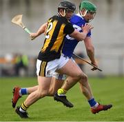 16 January 2022; Mickey Butler of Kilkenny is tackled by Roddy King of Laois during the Walsh Cup Group B match between Kilkenny and Laois at John Lockes GAA Club in Callan, Kilkenny. Photo by Ray McManus/Sportsfile