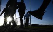 16 January 2022; Supporters walk from the East terrace to the West, to avoid the prevailing sun, during the Walsh Cup Group B match between Kilkenny and Laois at John Lockes GAA Club in Callan, Kilkenny. Photo by Ray McManus/Sportsfile