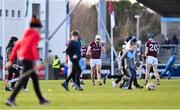 16 January 2022; Gearóid McInerney of Galway makes his way to his position for the second half, as children make their way off after playing at half-time, of the Walsh Cup Group A match between Dublin and Galway at Parnell Park in Dublin. Photo by Piaras Ó Mídheach/Sportsfile