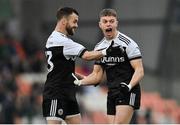 16 January 2022; Conor Laverty, left, and Jerome Johnston of Kilcoo celebrate winning a free during the AIB Ulster GAA Football Club Senior Championship Final match between Derrygonnelly Harps and Kilcoo at the Athletic Grounds in Armagh. Photo by Ramsey Cardy/Sportsfile