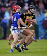 16 January 2022; Conor Heary of Kilkenny is tackled by Fiachra Fennell of Laois during the Walsh Cup Group B match between Kilkenny and Laois at John Lockes GAA Club in Callan, Kilkenny. Photo by Ray McManus/Sportsfile