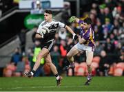 16 January 2022; Shealin Johnston of Kilcoo in action against Lee Jones of Derrygonnelly Harps during the AIB Ulster GAA Football Club Senior Championship Final match between Derrygonnelly Harps and Kilcoo at the Athletic Grounds in Armagh. Photo by Ramsey Cardy/Sportsfile