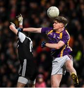16 January 2022; Aaron Jones of Derrygonnelly Harps and Conor Laverty of Kilcoo during the AIB Ulster GAA Football Club Senior Championship Final match between Derrygonnelly Harps and Kilcoo at the Athletic Grounds in Armagh. Photo by Ramsey Cardy/Sportsfile