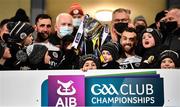 16 January 2022; Kilcoo joint-captains Aidan Branagan, left, and Conor Laverty lift the trophy with their children after the AIB Ulster GAA Football Club Senior Championship Final match between Derrygonnelly Harps and Kilcoo at the Athletic Grounds in Armagh. Photo by Ramsey Cardy/Sportsfile