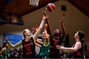18 January 2022; Niamh Rooney of Mount Anville in action against Pipers Hill College players Kate O'Neill, left, and  Stephanie Nnabuihe during the Pinergy Basketball Ireland U19 C Girls Schools Cup Final match between Mount Anville, Dublin, and Pipers Hill College, Kildare, at the National Basketball Arena in Dublin. Photo by Ben McShane/Sportsfile