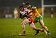 18 January 2022; Michael McEvoy of Derry in action against Tony McClenaghan of Donegal during the Dr McKenna Cup Semi-Final match between Donegal and Derry at Páirc MacCumhaill in Ballybofey, Donegal. Photo by David Fitzgerald/Sportsfile