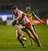 18 January 2022; Michael McEvoy of Derry in action against Tony McClenaghan of Donegal during the Dr McKenna Cup Semi-Final match between Donegal and Derry at Páirc MacCumhaill in Ballybofey, Donegal. Photo by David Fitzgerald/Sportsfile