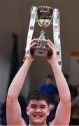 19 January 2022; St Munchin's College captain Reece Barry lifts the cup after his side's victory in the Pinergy Basketball Ireland U19 B Boys Schools Cup Final match between Blackrock College, Dublin, and St Munchin’s College, Limerick, at the National Basketball Arena in Dublin. Photo by Piaras Ó Mídheach/Sportsfile