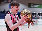 19 January 2022; Liam Price of St Munchin's College celebrates with his MVP award after the Pinergy Basketball Ireland U19 B Boys Schools Cup Final match between Blackrock College, Dublin, and St Munchin’s College, Limerick, at the National Basketball Arena in Dublin. Photo by Piaras Ó Mídheach/Sportsfile