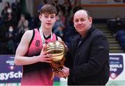 19 January 2022; Basketball Ireland president PJ Reidy presents the MVP award to Liam Price of St Munchin's College after the Pinergy Basketball Ireland U19 B Boys Schools Cup Final match between Blackrock College, Dublin, and St Munchin’s College, Limerick, at the National Basketball Arena in Dublin. Photo by Piaras Ó Mídheach/Sportsfile