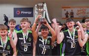 19 January 2022; Mercy Mounthawk captain Ryne Ybanez lifts the cup as he celebrates with teammates after their side's victory in the Pinergy Basketball Ireland U16 A Boys Schools Cup Final match between Malahide Community College, Dublin, and Mercy Mounthawk, Tralee, Kerry, at the National Basketball Arena in Dublin. Photo by Piaras Ó Mídheach/Sportsfile