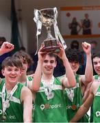 19 January 2022; St Malachy’s College captain Luke Donnelly lifts the cup as he celebrates with teammates after their side's victory in the Pinergy Basketball Ireland U19 A Boys Schools Cup Final match between St Malachy’s College, Belfast, and Mercy Mounthawk, Tralee, Kerry, at the National Basketball Arena in Dublin. Photo by Piaras Ó Mídheach/Sportsfile