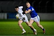 19 January 2022; Eoghan Lawless of Kildare in action against John O’Loughlin of Laois during the O'Byrne Cup Semi-Final match between Laois and Kildare at Netwatch Cullen Park in Carlow. Photo by Seb Daly/Sportsfile