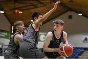 20 January 2022; Fionnan Burke of St Louis in action against Con Kirby, centre, and Rory Gleeson of Crescent Comprehensive  during the Pinergy Basketball Ireland U16 B Boys Schools Cup Final match between St Louis CS, Kiltimagh, Mayo and Crescent Comprehensive, Limerick, at the National Basketball Arena in Dublin. Photo by Harry Murphy/Sportsfile