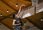 20 January 2022; Con Kirby of Crescent Comprehensive in action against Oisin McNicholas of St Louis  during the Pinergy Basketball Ireland U16 B Boys Schools Cup Final match between St Louis CS, Kiltimagh, Mayo and Crescent Comprehensive, Limerick, at the National Basketball Arena in Dublin. Photo by Harry Murphy/Sportsfile