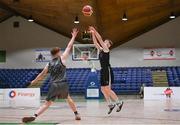 20 January 2022; Fionnan Burke of St Louis takes a shot under pressure from Sean Morrissey of Crescent Comprehensive during the Pinergy Basketball Ireland U16 B Boys Schools Cup Final match between St Louis CS, Kiltimagh, Mayo and Crescent Comprehensive, Limerick, at the National Basketball Arena in Dublin. Photo by Harry Murphy/Sportsfile