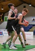 20 January 2022; Sean Morrissey of Crescent Comprehensive in action against Oisin Mulderrig of St Louis during the Pinergy Basketball Ireland U16 B Boys Schools Cup Final match between St Louis CS, Kiltimagh, Mayo and Crescent Comprehensive, Limerick, at the National Basketball Arena in Dublin. Photo by Harry Murphy/Sportsfile