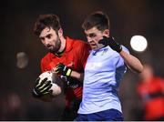 19 January 2022; Daniel O'Brien of UCC in action against Ruari McCormack of UCD during the Electric Ireland Higher Education GAA Sigerson Cup Round 2 match between University College Dublin and University College Cork at UCD Billings Park in Dublin. Photo by Stephen McCarthy/Sportsfile