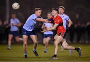 19 January 2022; Diarmuid O'Connor of UCC in action against Kieran Kennedy of UCD during the Electric Ireland Higher Education GAA Sigerson Cup Round 2 match between University College Dublin and University College Cork at UCD Billings Park in Dublin. Photo by Stephen McCarthy/Sportsfile
