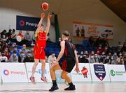20 January 2022; Óisin Ó Treasaigh of Gaelcholáiste Cheatharlach takes a shot under pressure from Aivaras Uosis of Pobailscoil Chorca Dhuibhne during the Pinergy Basketball Ireland U19 C Boys Schools Cup Final match between Gaelcholaiste Cheatharlach, Carlow, and Pobailscoil Chorca Dhuibhne, Dingle, Kerry, at the National Basketball Arena in Dublin. Photo by Harry Murphy/Sportsfile