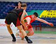 20 January 2022; Milo Ó Fiacháin of Gaelcholáiste Cheatharlach in action against Aivaras Uosis of Pobailscoil Chorca Dhuibhne during the Pinergy Basketball Ireland U19 C Boys Schools Cup Final match between Gaelcholaiste Cheatharlach, Carlow, and Pobailscoil Chorca Dhuibhne, Dingle, Kerry, at the National Basketball Arena in Dublin. Photo by Harry Murphy/Sportsfile