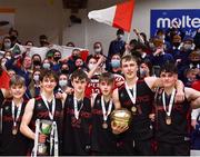 20 January 2022; Pobailscoil Chorca Dhuibhne players celebrate with the trophy after their side's victory in the Pinergy Basketball Ireland U19 C Boys Schools Cup Final match between Gaelcholaiste Cheatharlach, Carlow, and Pobailscoil Chorca Dhuibhne, Dingle, Kerry, at the National Basketball Arena in Dublin. Photo by Harry Murphy/Sportsfile