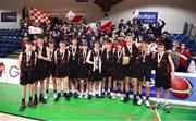 20 January 2022; Pobailscoil Chorca Dhuibhne players celebrate with the trophy after their side's victory in the Pinergy Basketball Ireland U19 C Boys Schools Cup Final match between Gaelcholaiste Cheatharlach, Carlow, and Pobailscoil Chorca Dhuibhne, Dingle, Kerry, at the National Basketball Arena in Dublin. Photo by Harry Murphy/Sportsfile