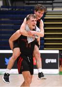 20 January 2022; Aivaras Uosis, front, and Patrick Mac Sandair of Pobailscoil Chorca Dhuibhne celebrate after their side's victory in the Pinergy Basketball Ireland U19 C Boys Schools Cup Final match between Gaelcholaiste Cheatharlach, Carlow, and Pobailscoil Chorca Dhuibhne, Dingle, Kerry, at the National Basketball Arena in Dublin. Photo by Harry Murphy/Sportsfile