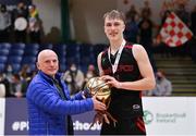20 January 2022; Aivaras Uosis of Pobailscoil Chorca Dhuibhne is presented the MVP award by Ger Tarrant after the Pinergy Basketball Ireland U19 C Boys Schools Cup Final match between Gaelcholaiste Cheatharlach, Carlow, and Pobailscoil Chorca Dhuibhne, Dingle, Kerry, at the National Basketball Arena in Dublin. Photo by Harry Murphy/Sportsfile